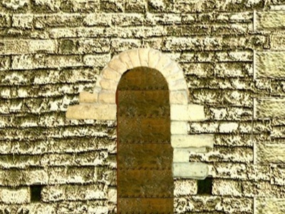 Arco de medio punto con despiece de dovelas en la fachada norte de la torre defensiva de Alfonso III.